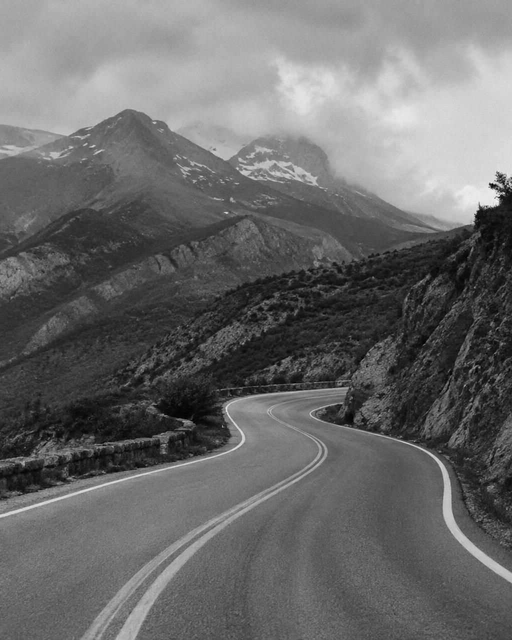 Black and white mountain road winding through the landscape